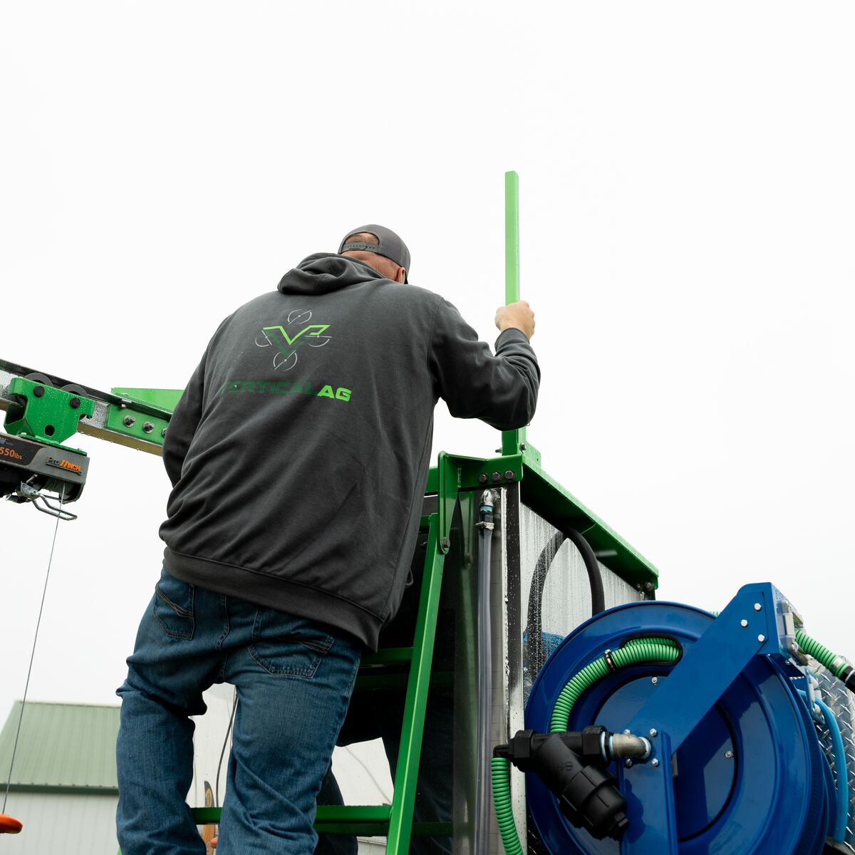 Operator climbing the Field Boss Skid ladder