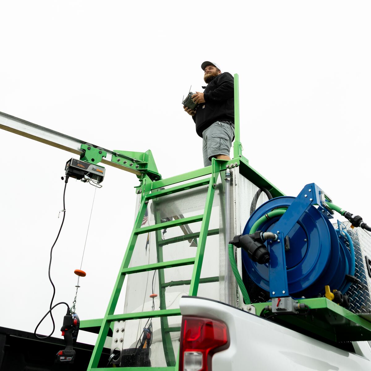Pilot standing on the Field Boss Skid observation area
