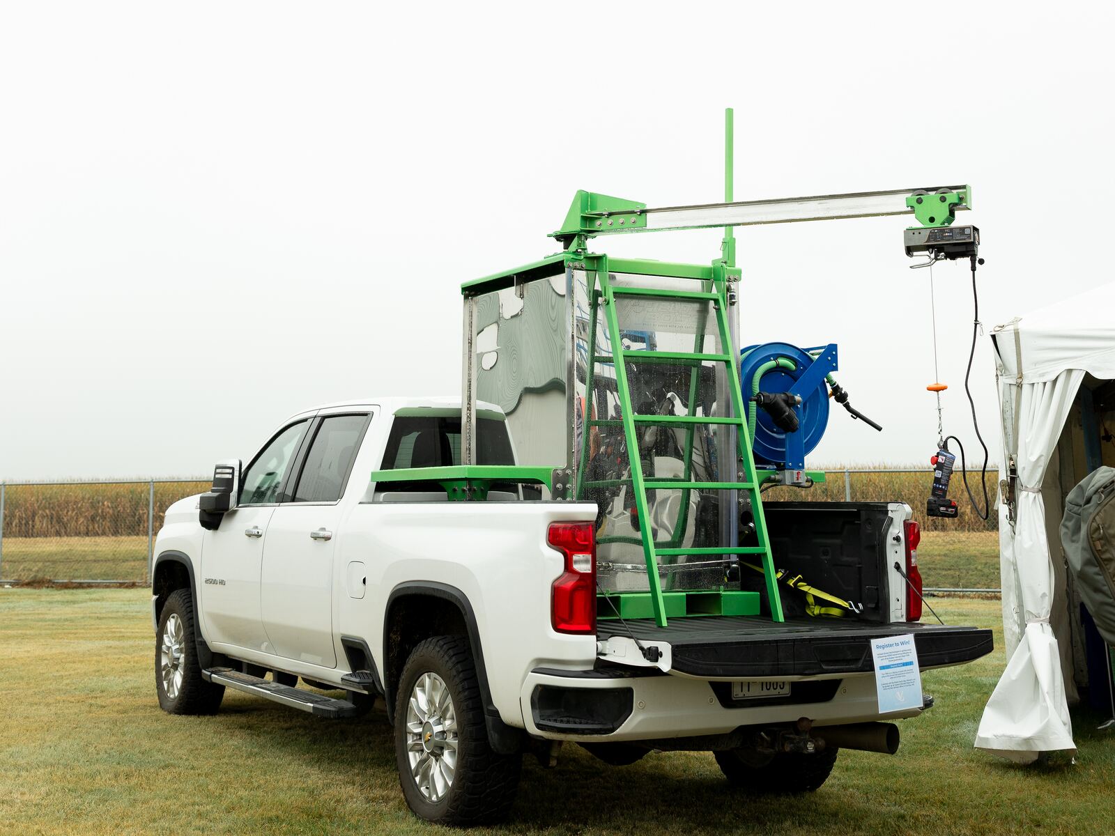 Field Boss Skid in the bed of a pickup with crane, ladder and hose reel